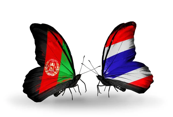 Deux papillons avec des drapeaux d'Afghanistan et de Thaïlande — Photo