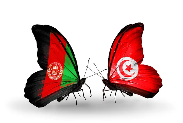 Dwa motyle z flagami w Afganistanie i Tunezja — Zdjęcie stockowe