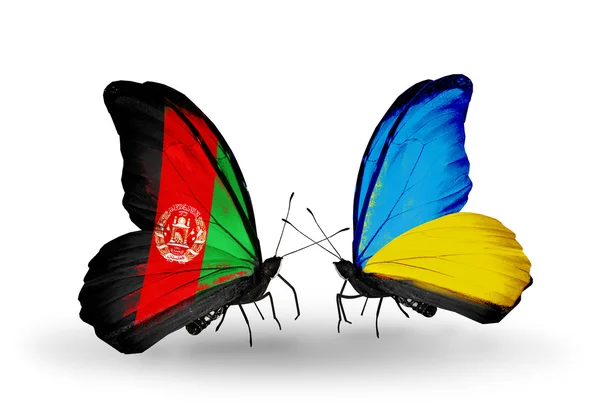 Две бабочки с флагами Афганистана и Украины — стоковое фото