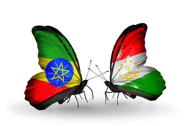 Twee vlinders met vlaggen van Ethiopië en Tadzjikistan — Stockfoto