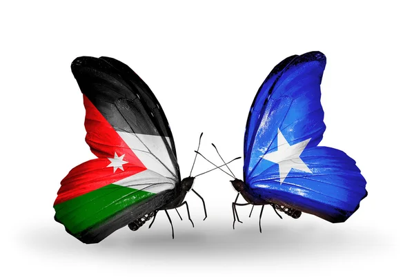 Zwei Schmetterlinge mit jordanischen und somalischen Flaggen — Stockfoto