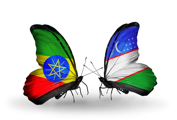 Deux papillons avec des drapeaux de l'Ethiopie et de l'Ouzbékistan — Photo