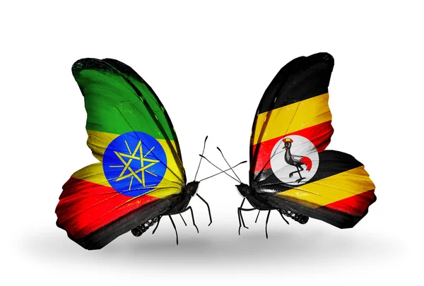 Twee vlinders met vlaggen van Ethiopië en Oeganda — Stockfoto