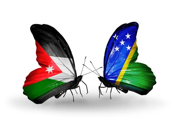 Zwei Schmetterlinge mit Flaggen jordanischer und salomonischer Inseln — Stockfoto