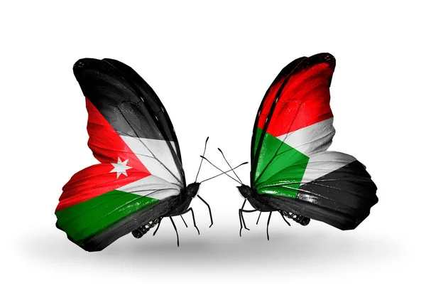 Δύο πεταλούδες με σημαίες της Ιορδανίας και του Σουδάν — Φωτογραφία Αρχείου