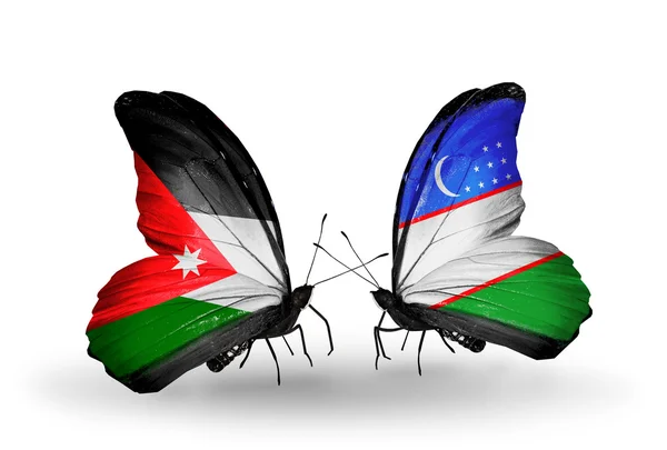 Jordan ve Özbekistan bayrakları taşıyan iki kelebek — Stok fotoğraf