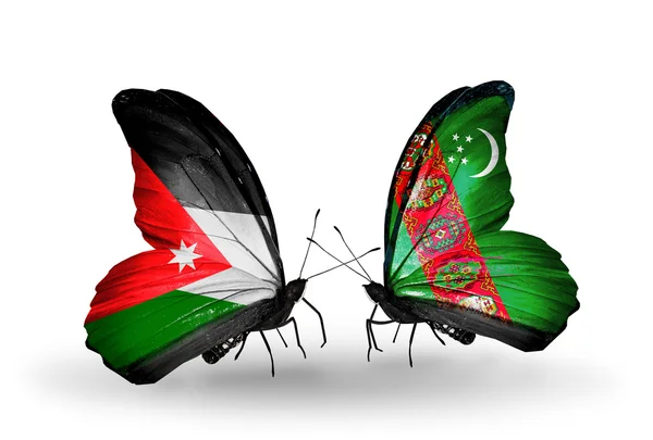 Twee vlinders met vlaggen van Jordanië en turkmenistan — Stockfoto