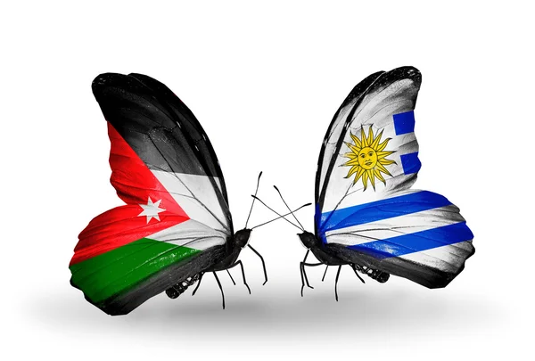 Two butterflies with flags  of Jordan and Uruguay — Stock Photo, Image