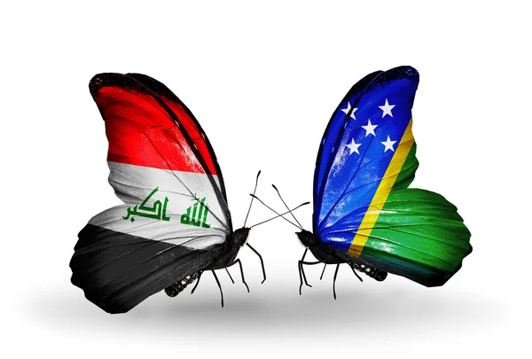 Dos mariposas con banderas de Irak y las Islas Salomón — Foto de Stock