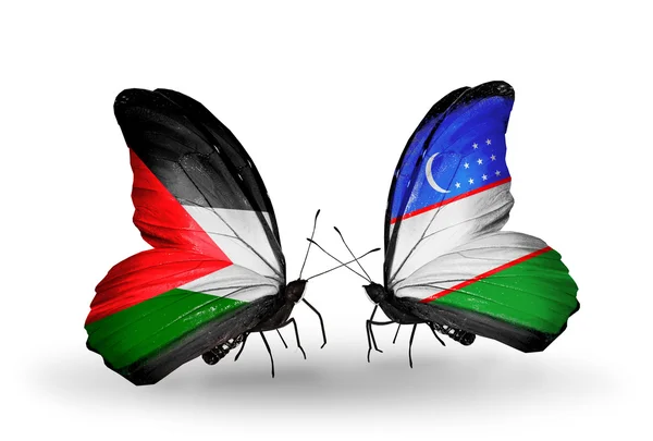 パレスチナとウズベキスタンの国旗と 2 匹の蝶 — ストック写真