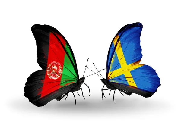 Afganistan ve İsveç bayrakları taşıyan iki kelebek — Stok fotoğraf