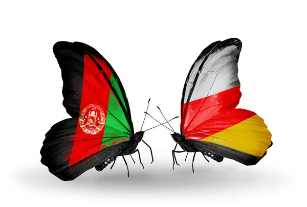 两只蝴蝶与阿富汗和南奥塞梯的国旗 — 图库照片