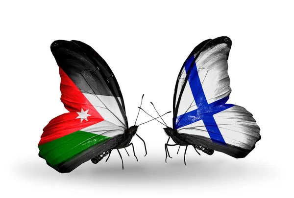 Iki kelebek Ürdün ve Finlandiya bayrağı ile — Stok fotoğraf