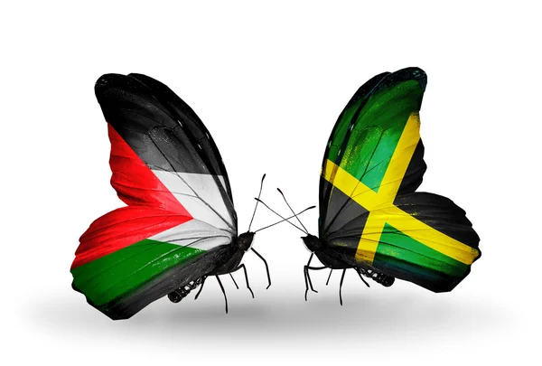 Dwa motyle z flagami Palestyny i Jamajka — Zdjęcie stockowe