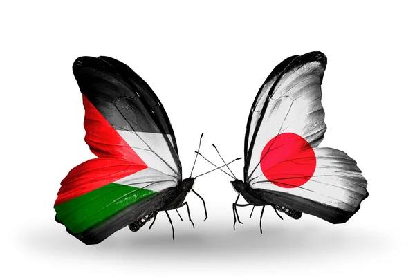 Two butterflies with flags  of Palestine and Japan — Stock Photo, Image