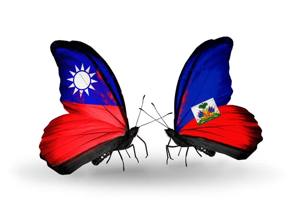 Papillons avec drapeaux Taïwan et Haïti sur les ailes — Photo