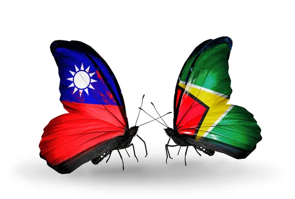 Farfalle con bandiere di Taiwan e Guyana sulle ali — Foto Stock