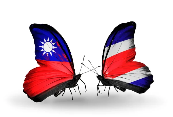 Vlinders met taiwan en costa rica vlaggen op vleugels — Stockfoto