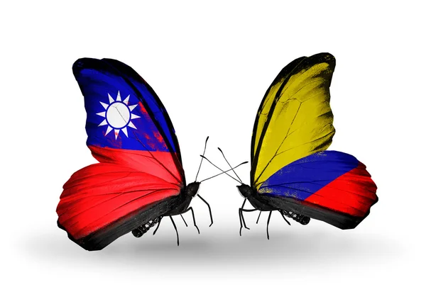 Motýli s Tchaj-wanem a columbia vlajky na křídlech — Stock fotografie