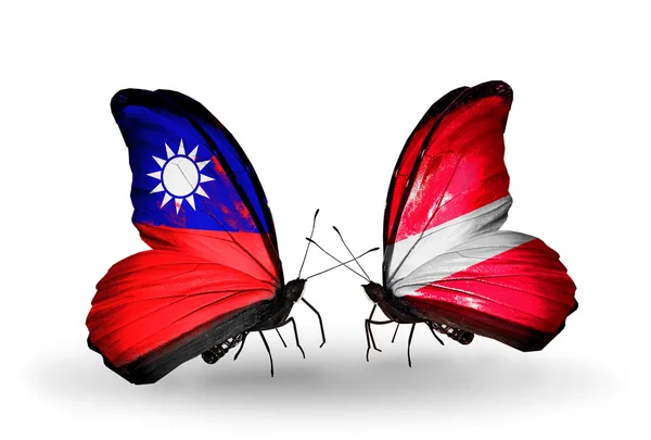 Mariposas con banderas de Taiwán y Letonia en alas —  Fotos de Stock
