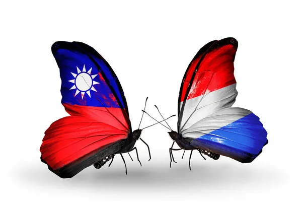 Butterflies with Taiwan and Luxembourg flags on wings — Stock Photo, Image