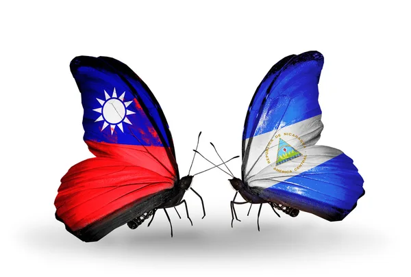 Borboletas com bandeiras de Taiwan e Nicarágua em asas — Fotografia de Stock