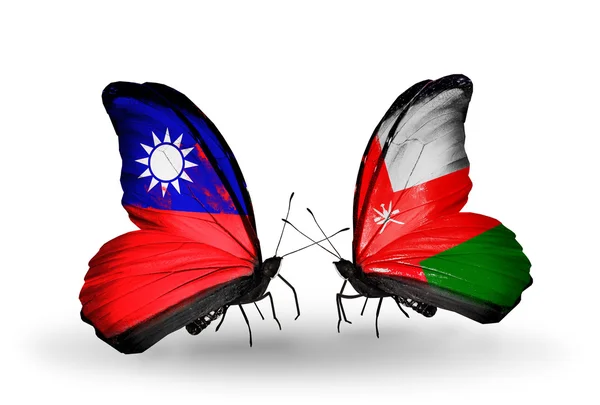 Farfalle con bandiere Taiwan e Oman sulle ali — Foto Stock