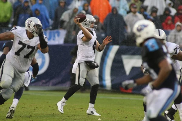 stock image Oakland Raiders QB Derek Carr throws a pass against the Tennessee Titans on November 29, 2015, in Nashville, Tennessee. 
