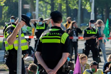 Police Men Guarding The Demonstrators The Rebellion Extinction Demonstration At Amsterdam South The Netherlands 21-9-2020 clipart