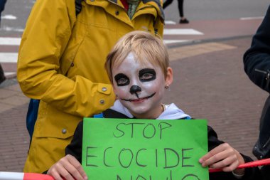 Child Protesting At The Climate Demonstration From The Extinction Rebellion Group At Amsterdam The Netherlands 2019 clipart