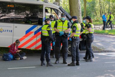 Group Of Policemen During The Rebellion Extinction Demonstration At Amsterdam The Netherlands 21-9-2020 clipart