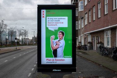 Hollanda 2-1-2022 Amsterdam 'da Corona' ya karşı reklam panosu çekimini yapın.