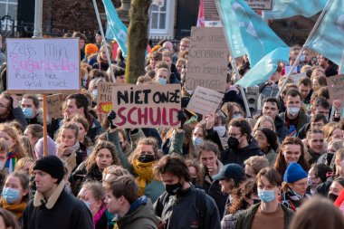 Group Of Protesters Walking At The Niet Mijn Schuld Demonstration At Amsterdam The Netherlands 5-2-2022