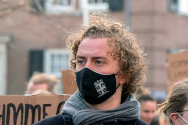 Young Man Having A Mouthcap At The Niet Mijn Schuld Demonstration At Amsterdam The Netherlands 5-2-2022