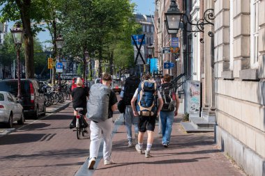 Backpack Tourists At At Amsterdam The Netherlands 23-6-2022