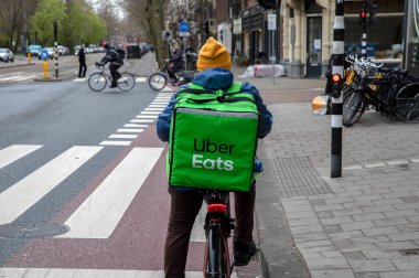 Backside Uber Eats Delivery Man At Amsterdam The Netherlands 6-4-2022