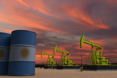 Güneş batarken hava bulutlu ve petrol varillerinin üzerinde ARGENTINA bayrağı asılı.