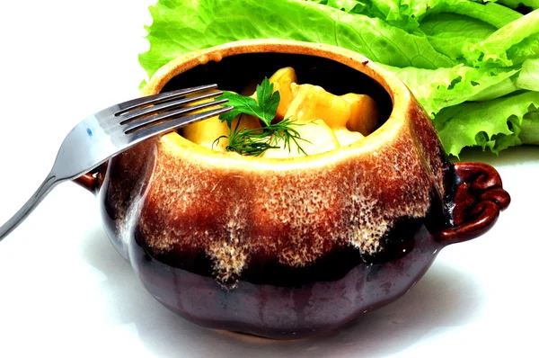 Meat and potatoes baked in a pot — Stock Photo, Image