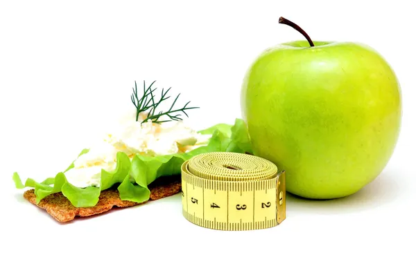 Crispbread with Cheese, apple and measuring tape — Stock Photo, Image