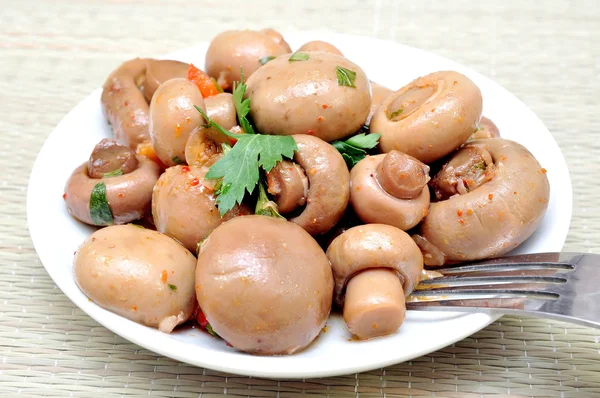 Marinated mushrooms on a plate — Stock Photo, Image