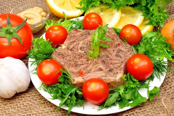 Jellied meat with fresh herbs — Stock Photo, Image