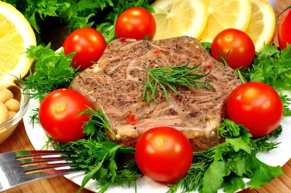 Jellied meat with fresh herbs — Stock Photo, Image