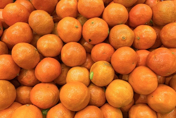 Achtergrond van verse smakelijke mandarijn — Stockfoto