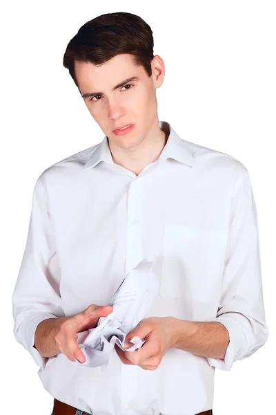 Young man in anger crushes document — Stock Photo, Image