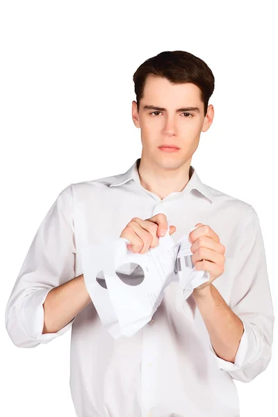 Angry young man crumples tears paper — Stock Photo, Image