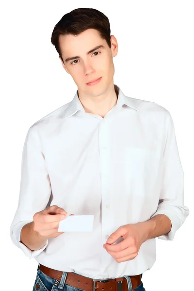 Young man holding out business card in white shirt isolated — Stock Photo, Image