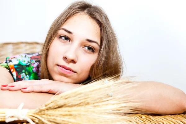 Young girl on background of wheat ears — Stock Photo, Image