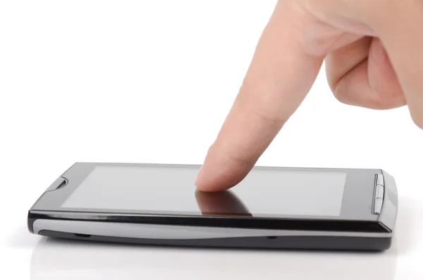 Chytrý telefon a prst na bílém pozadí — Stock fotografie