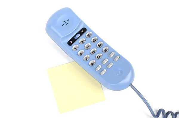 Telefone e papel de carta sobre fundo branco — Fotografia de Stock