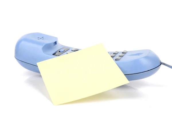 Telefone e papel de carta sobre fundo branco — Fotografia de Stock